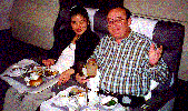 Bruce and Jing in a Boeing 777 first class cabin