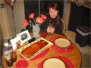 Kapitoshka and Mom at dinner time, love that salmon that Dad cooks!